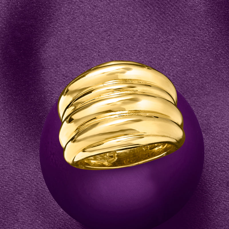 18kt yellow gold ribbed ring on finger, domed wide band with curved ridges