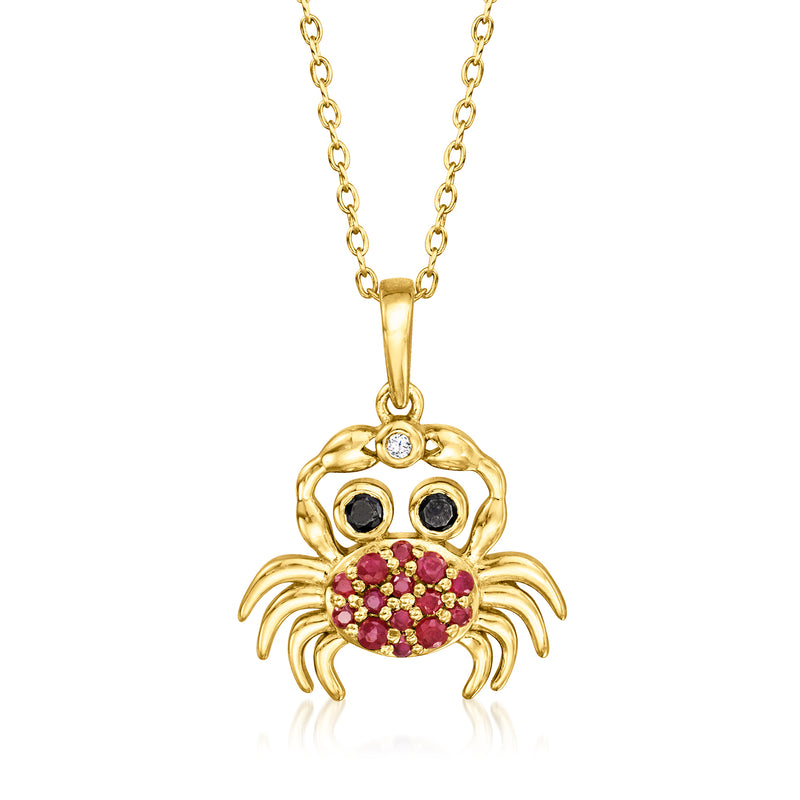 Gold crab pendant necklace with ruby-red and black stones, single diamond accent
