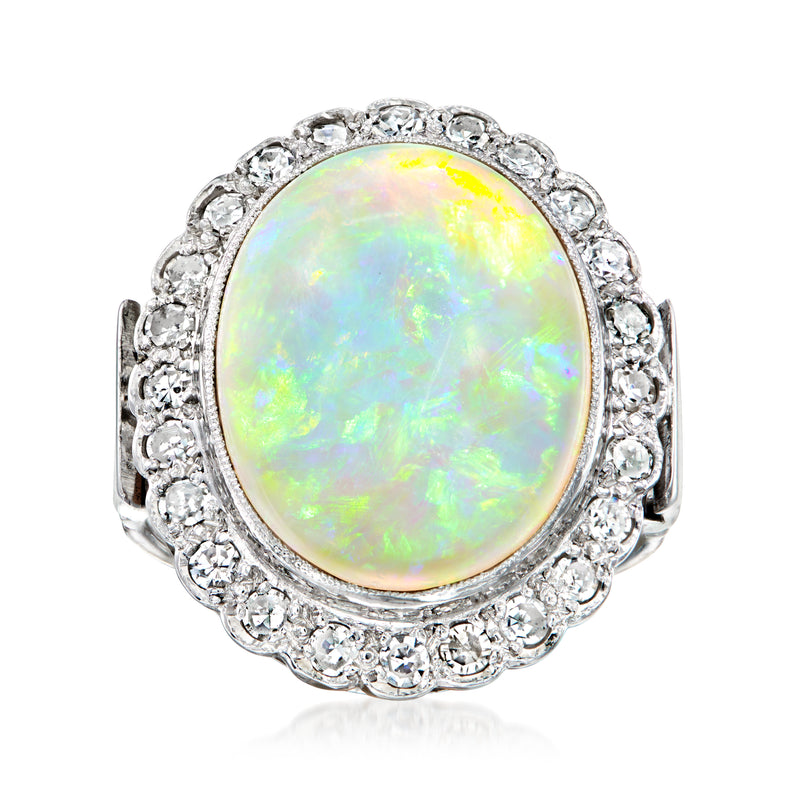 Oval opal center stone with diamond halo ring in 18kt white gold