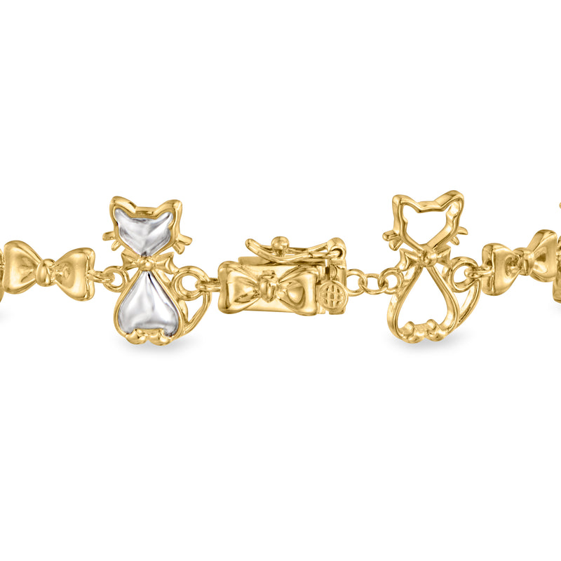 Cat bow bracelet, gold-tone with white cat charms and heart detail, clasp close-up