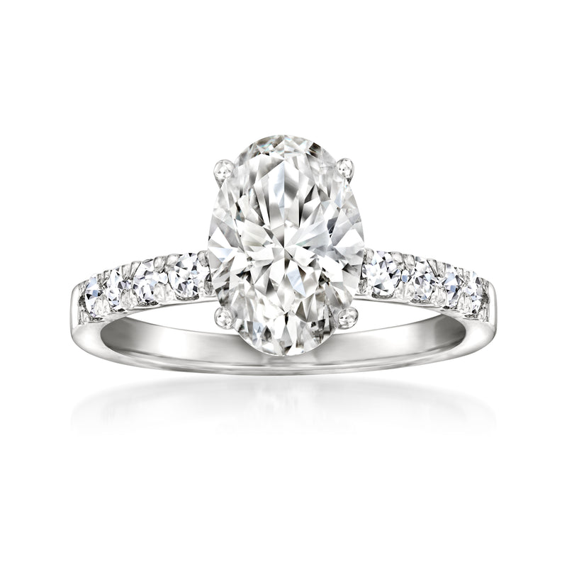 14kt white gold ring with large lab-grown diamond and smaller side stones