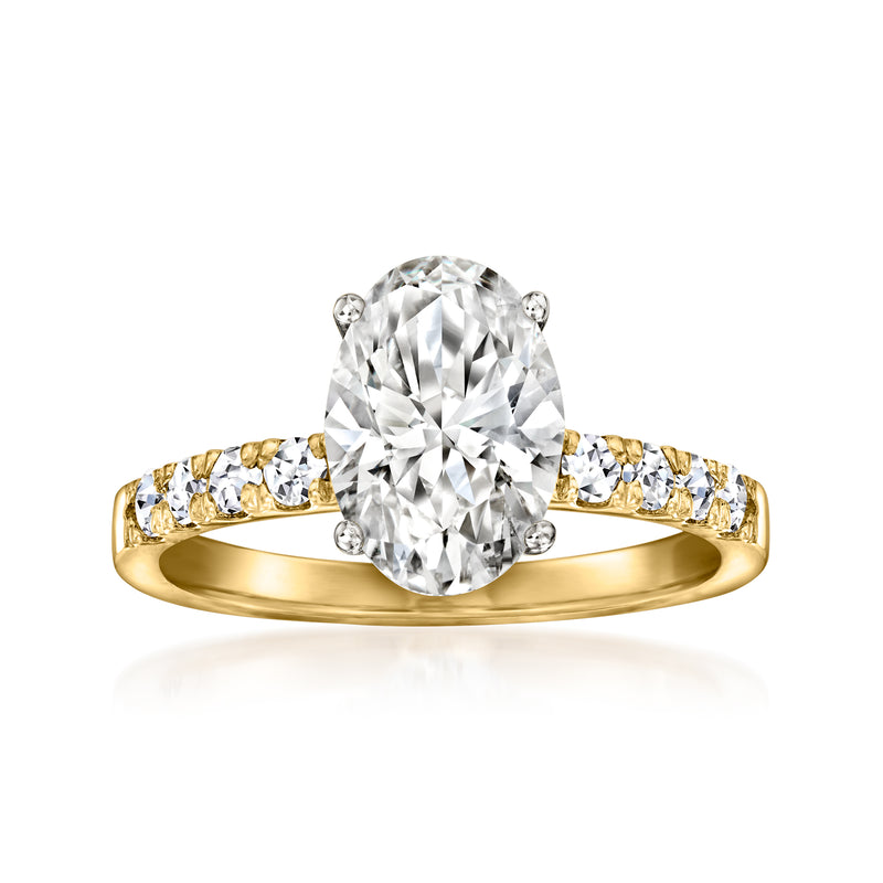 14kt yellow gold diamond ring with oval center and small side stones