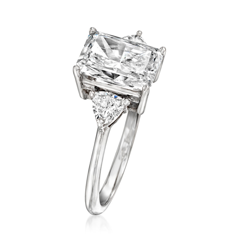 Radiant-cut diamond ring with square center and side trillion accents on white gold band