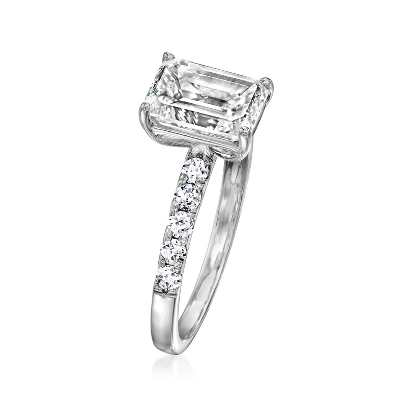 14kt white gold diamond ring with emerald-cut center stone and slender baguette-set band