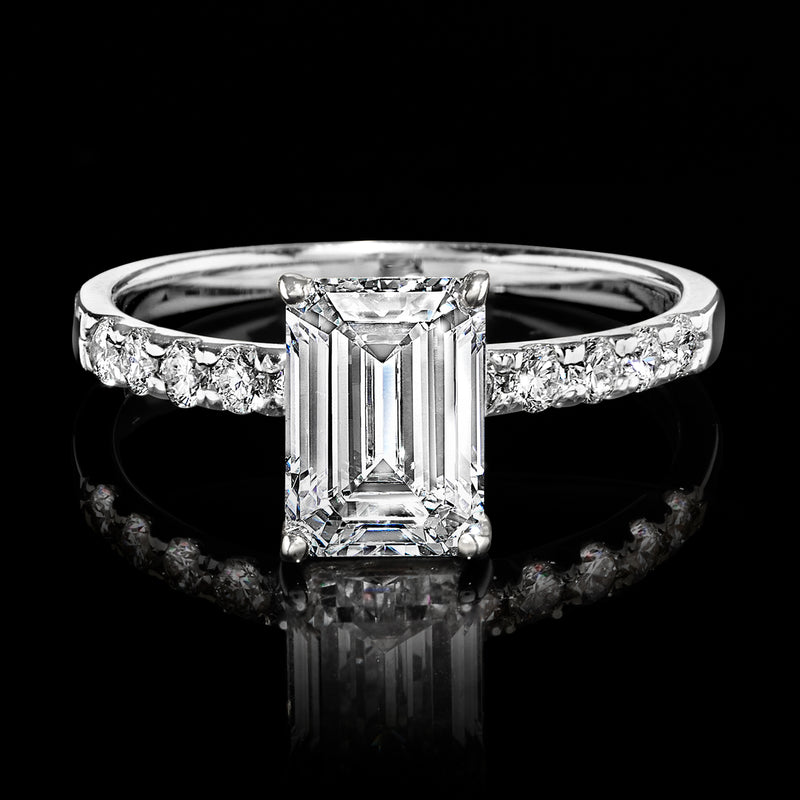 14kt white gold diamond ring with emerald-cut center diamond and baguette side accents
