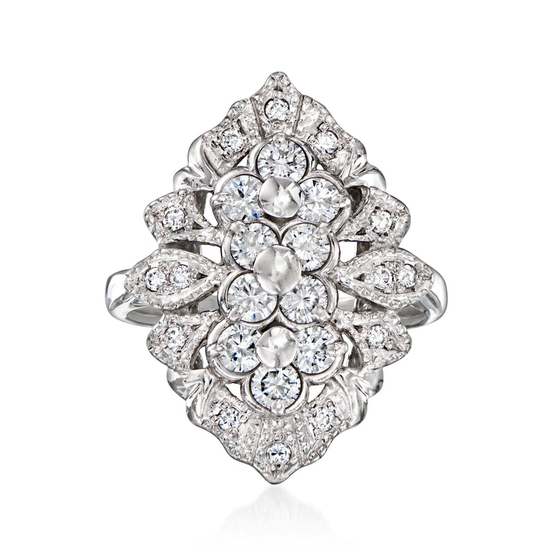 Vintage platinum diamond cluster ring with prong-set round diamonds in ornate floral design