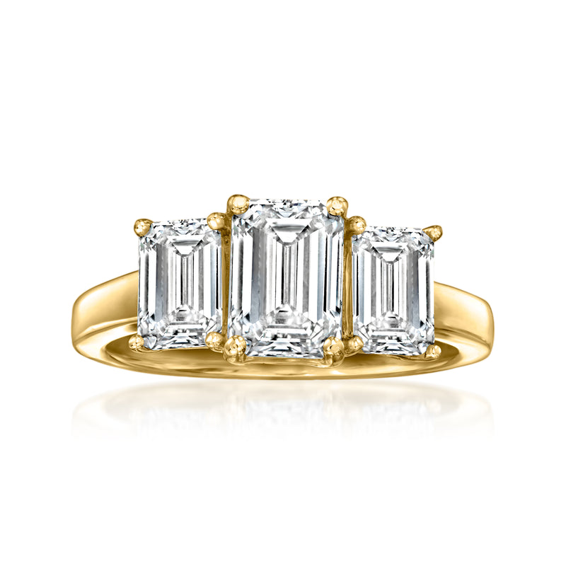 Three-stone emerald-cut diamond ring in 14kt yellow gold, three square-cut stones