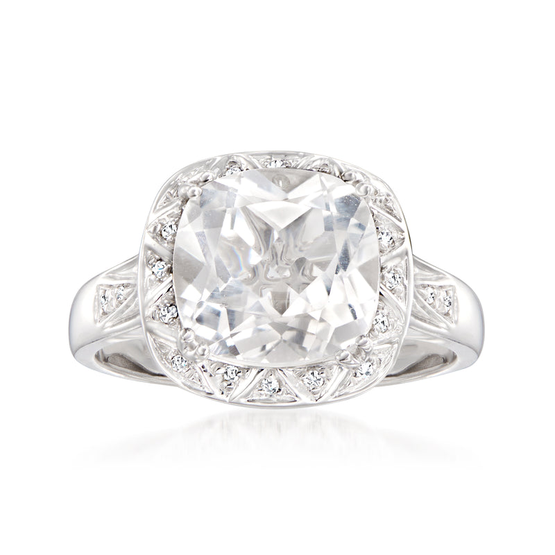 14kt white gold ring with large cushion-cut white topaz center and diamond halo