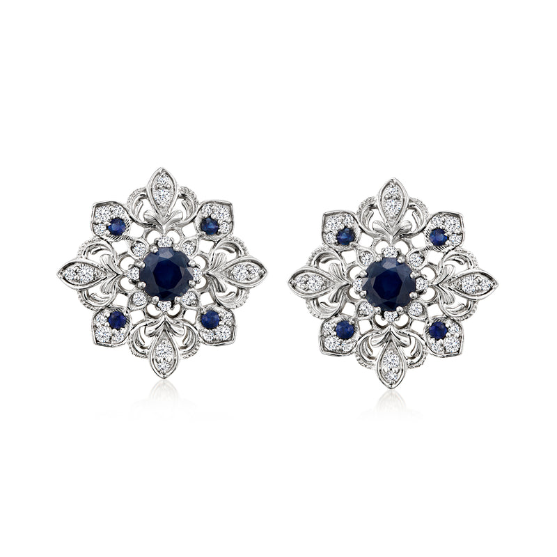 Sterling silver floral stud earrings with blue sapphire centers and diamond accents