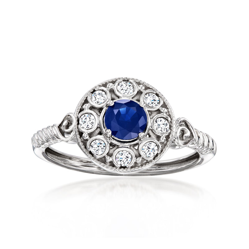 14kt white gold halo ring with round blue sapphire and diamond accents