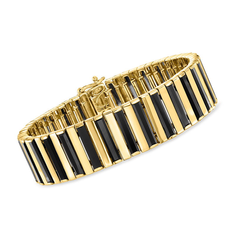 Gold-tone bracelet with alternating black and gold rectangular link design