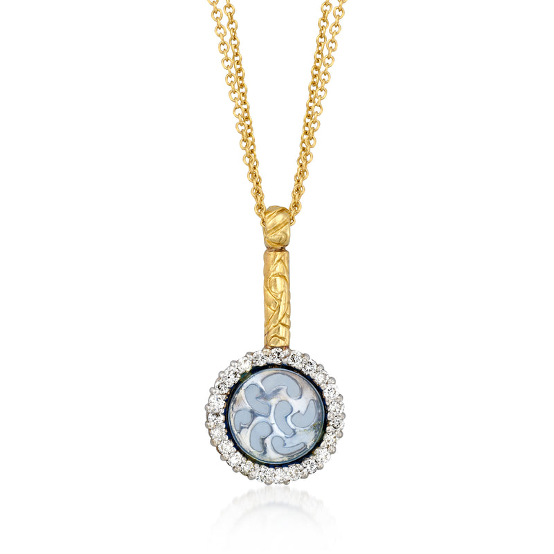 Two-tone gold necklace with round blue glass pendant, diamond halo and twisted bail.