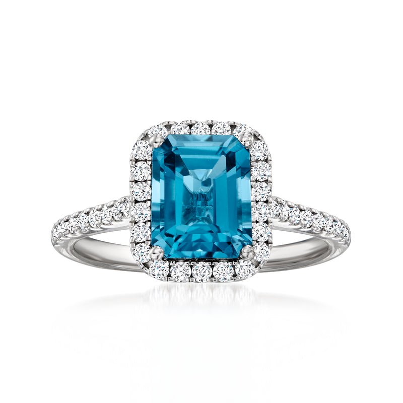 14kt white gold ring with large London blue topaz center and round diamond halo