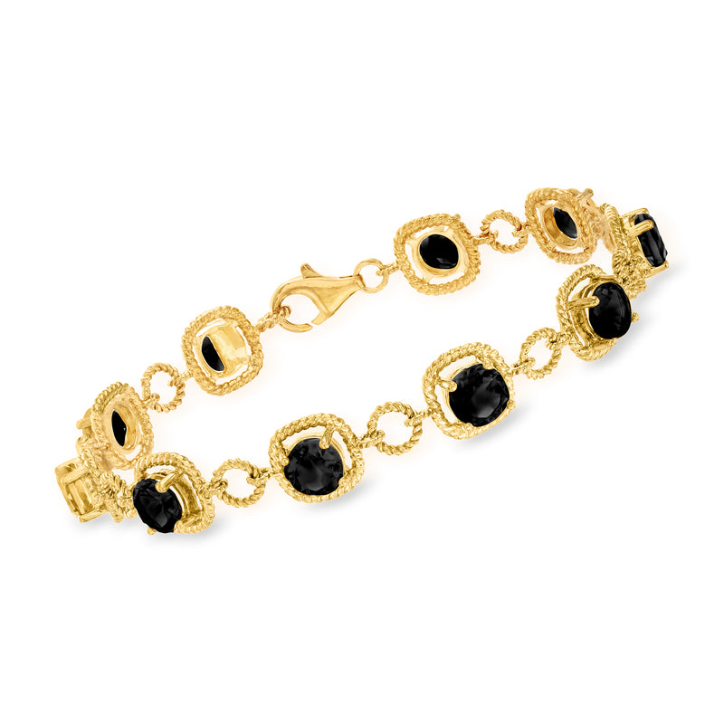 Gold-tone onyx bracelet with oval black stones and circular link accents