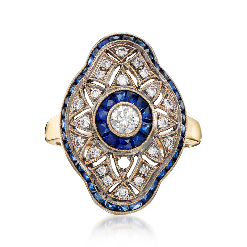 Vintage yellow gold filigree ring with round diamond center and blue sapphire border