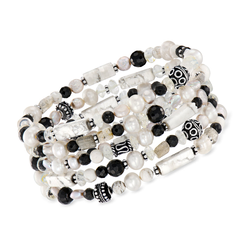 Stretch bracelet set with white and black beads and silver-tone charms
