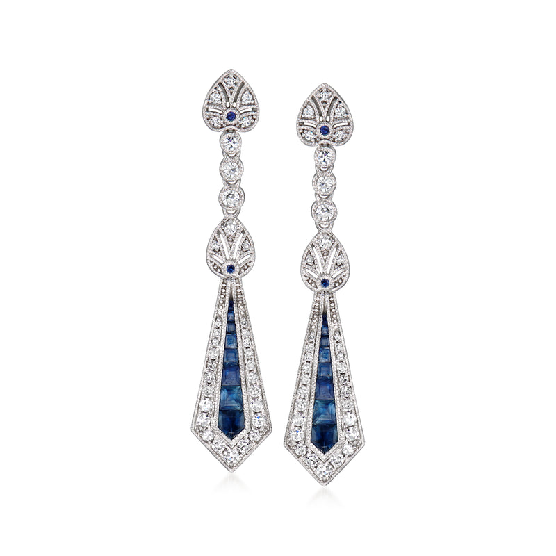 White gold drop earrings with blue sapphire teardrop center and diamond halo drops