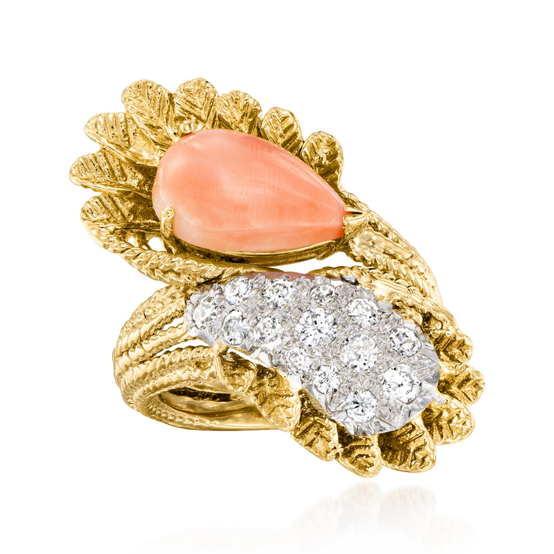 Vintage yellow gold bypass ring with oval pink coral and diamond cluster halo
