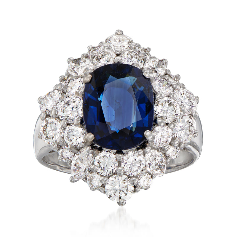 Vintage sapphire and diamond ring in white gold with oval blue center halo of round diamonds