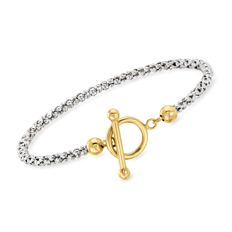Silver popcorn-chain toggle bracelet with gold tone clasp and ring accents