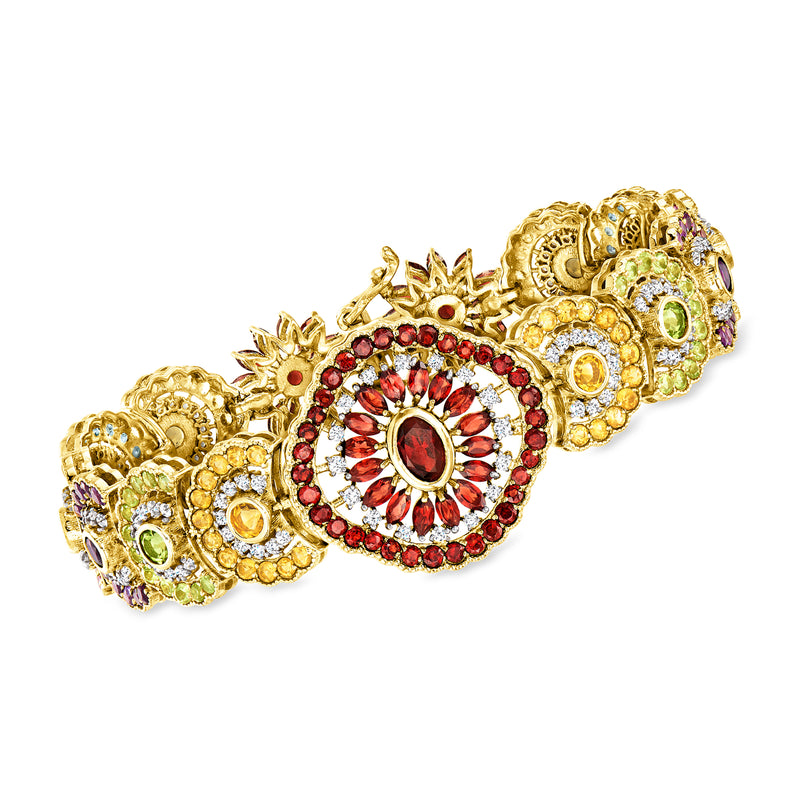 Gold floral gemstone bracelet with round red center medallion and multicolor accents