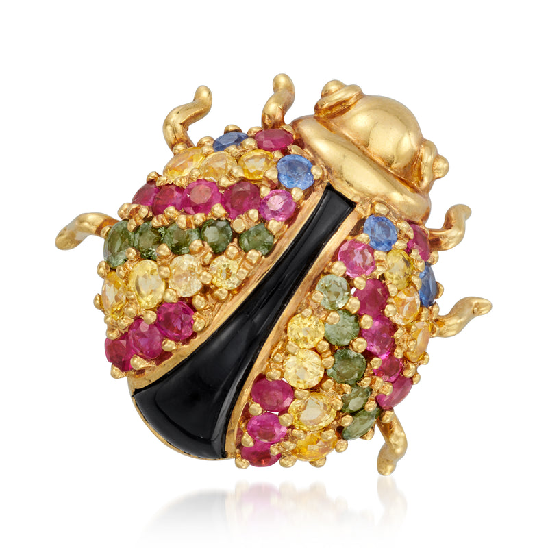 Gold ladybug pin with black enamel wing and multicolored gemstone body