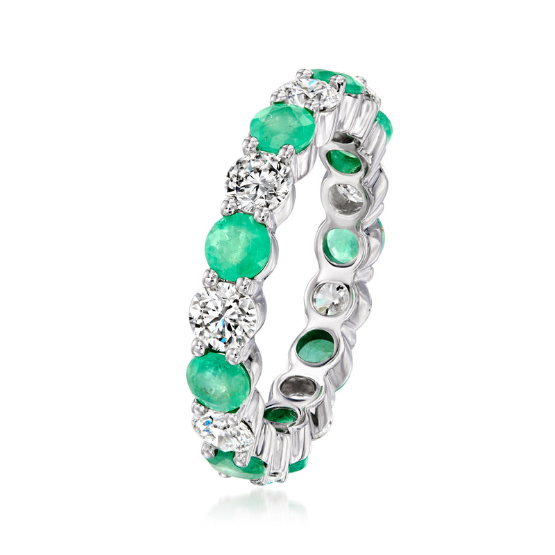 White gold eternity band, side view with green emerald stones and round diamonds
