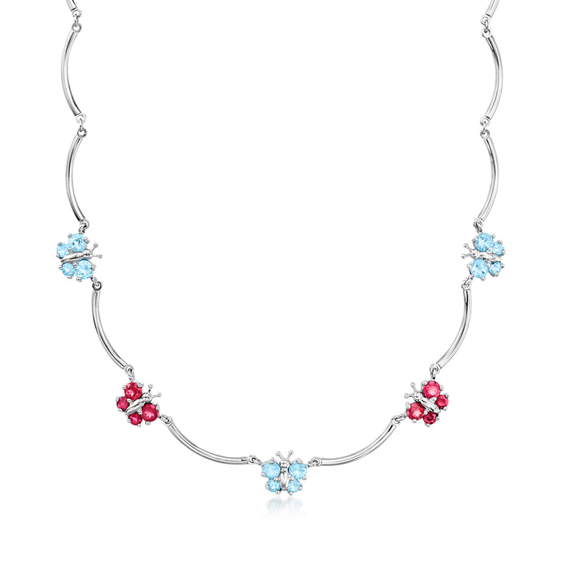 White gold butterfly station necklace with blue and pink gemstones