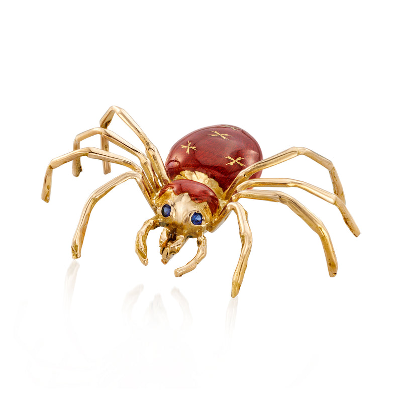 Vintage spider pin in gold with red enamel body and blue sapphire eyes, detailed legs
