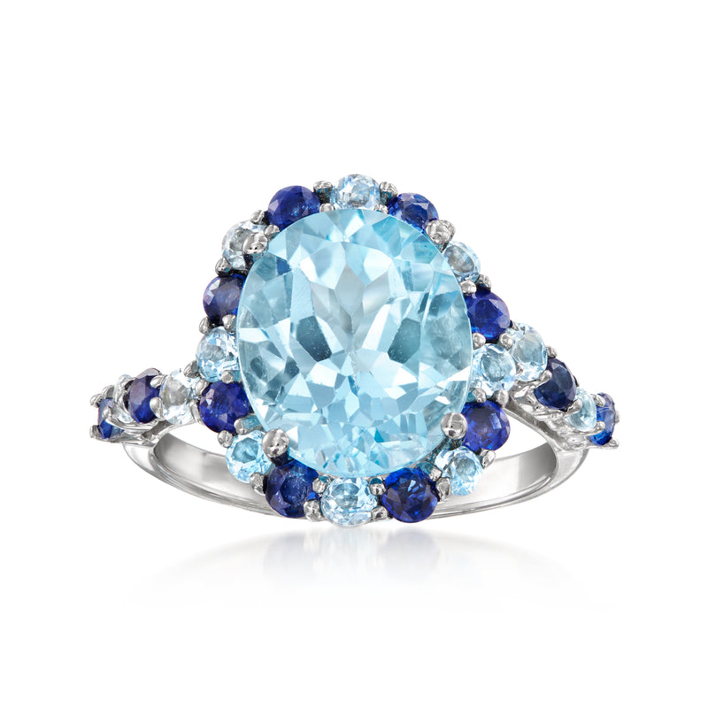 Oval light-blue gemstone halo ring in white gold with blue sapphires and clear accents