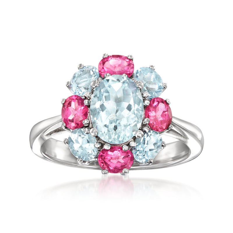 White gold ring with oval aquamarine center and pink tourmaline side stones