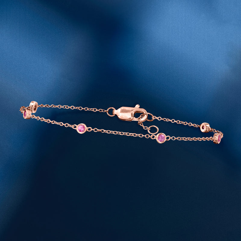 Rose gold chain station bracelet with round pink sapphire stations and secure clasp