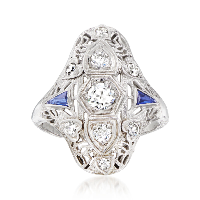 Vintage white gold filigree diamond ring with blue sapphire accents, four-stone halo