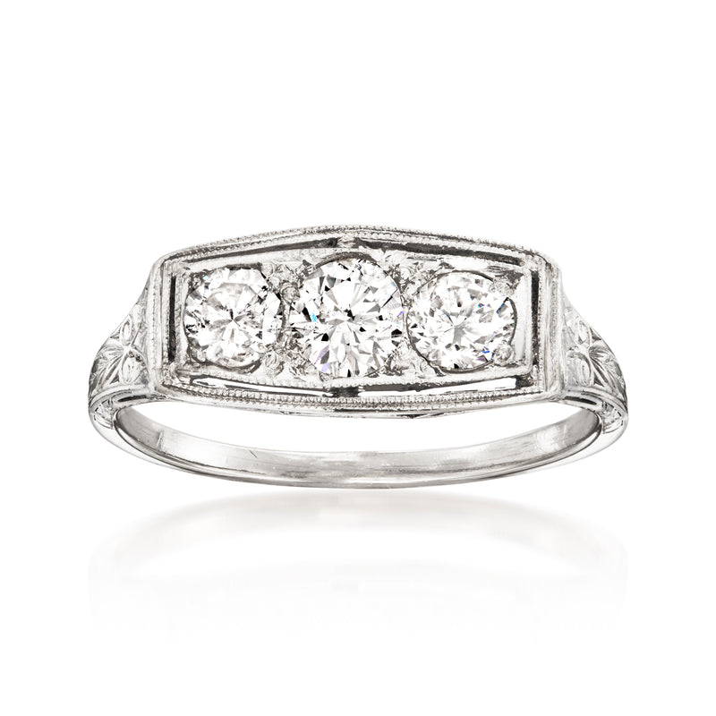Platinum vintage filigree diamond ring with three-stone rectangular top and raised bezel