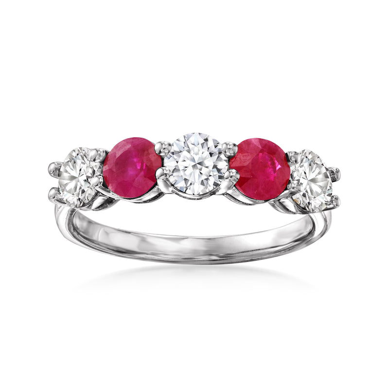 14kt white gold ring with round center diamond, ruby side stones, and diamond accents