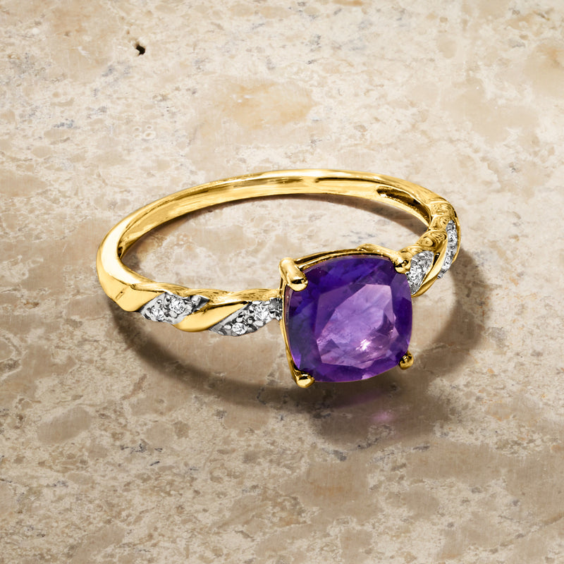 Amethyst twist ring with purple cushion stone and diamond-set wave shoulders