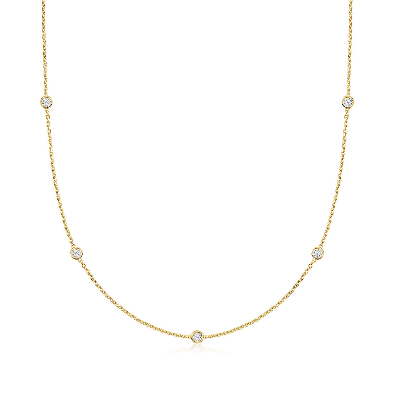 Gold station necklace with round clear diamond accents in a line