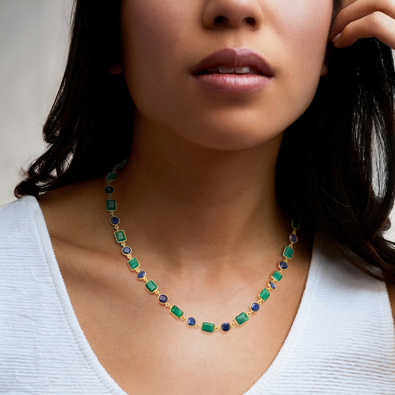Gemstone necklace worn: green emerald-like squares with blue round sapphire accents in gold