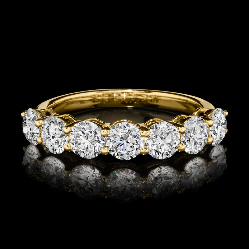 Seven-stone diamond ring in 14kt yellow gold with six round stones on a bright polished band