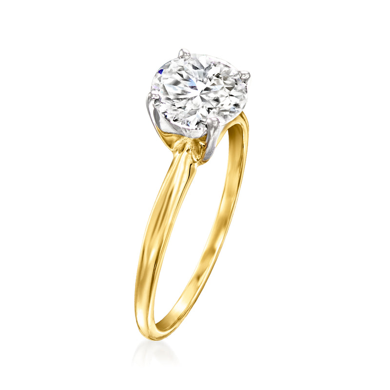 14kt yellow gold solitaire ring with round diamond center and raised prongs