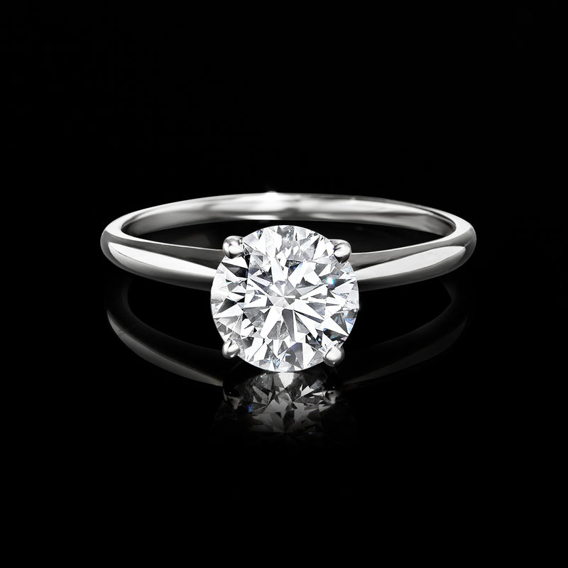 14kt white gold solitaire diamond ring with round center stone and slim band