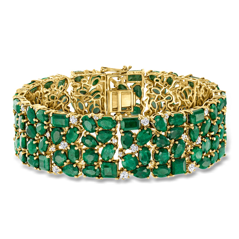 Gold over sterling bracelet with emerald-green gemstones and small white accents, hinged style.