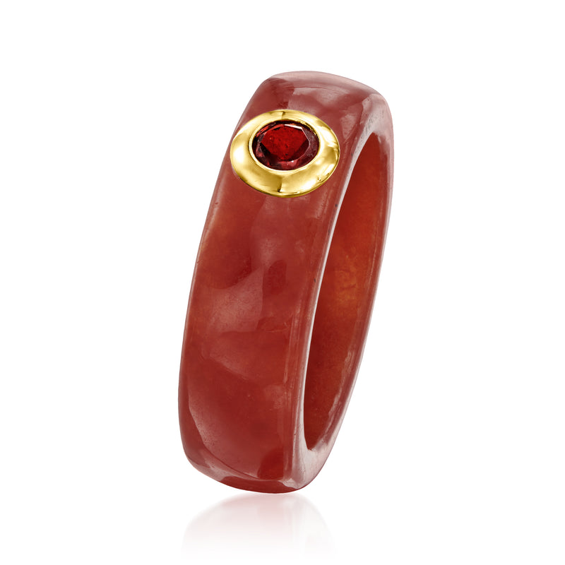 Red jade ring with round garnet in yellow gold bezel, angled side view