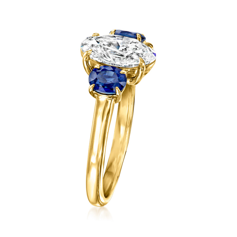 14kt yellow gold ring with round diamond center and blue sapphire settings