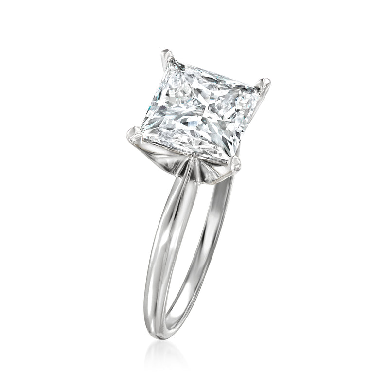 Princess-cut diamond solitaire ring in 14kt white gold, side view of prongs