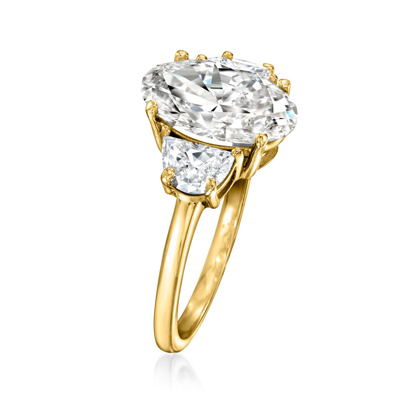 Yellow gold oval and half-moon diamond ring, angled view of prong settings