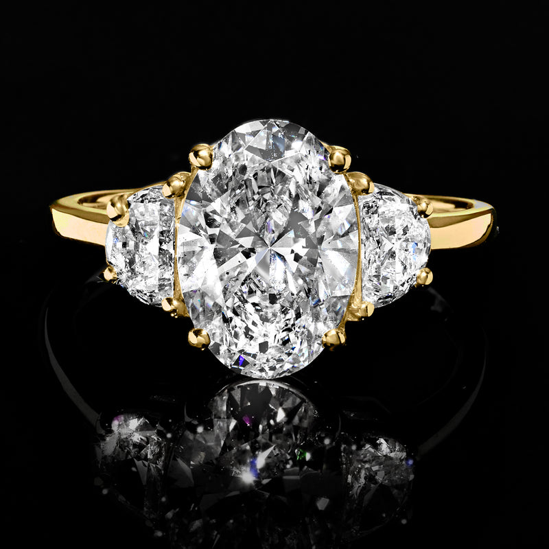 14kt yellow gold diamond ring with oval center and two round side stones
