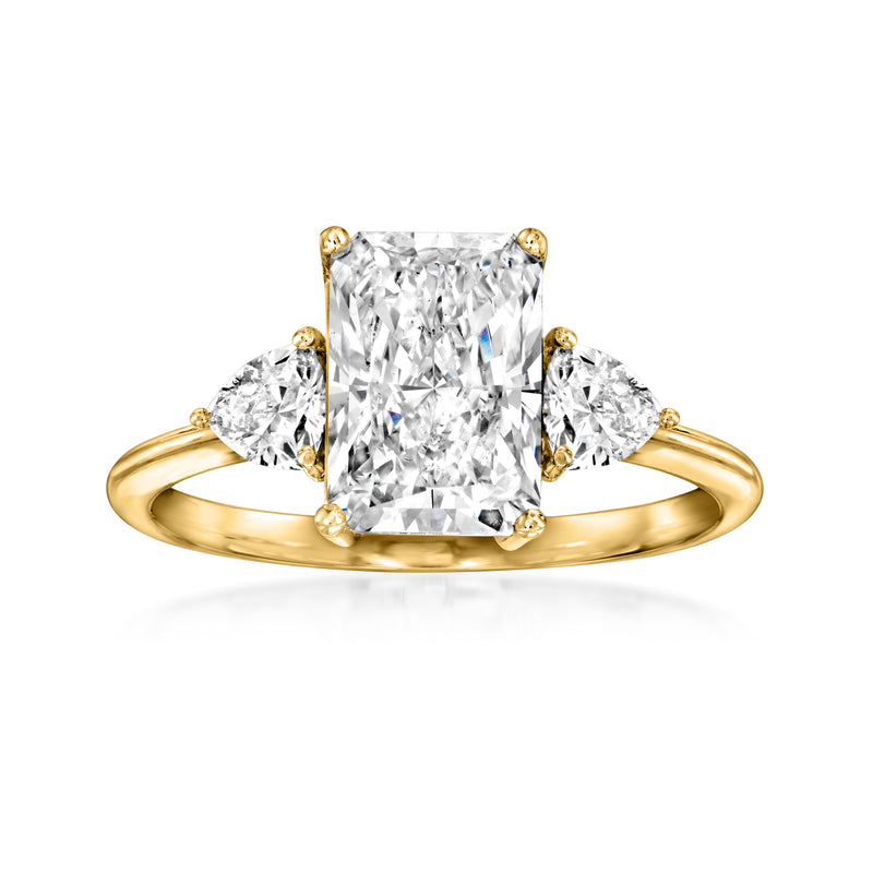 14kt yellow gold ring with large radiant diamond and three prong-set stones