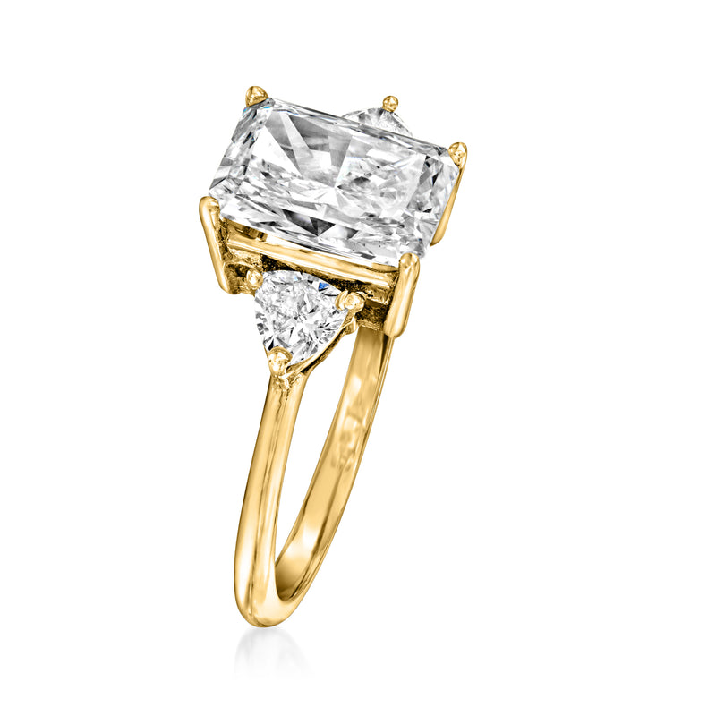 14kt yellow gold ring with radiant-cut center diamond and angled side stones
