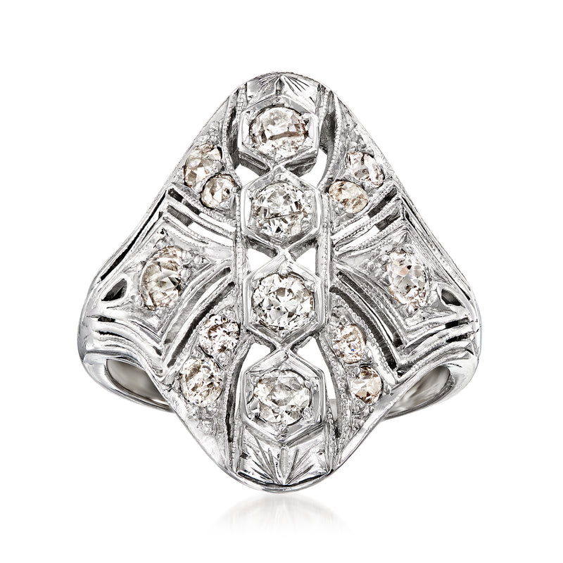 Vintage diamond dinner ring in 18kt white gold with oval center and bezel-set stones